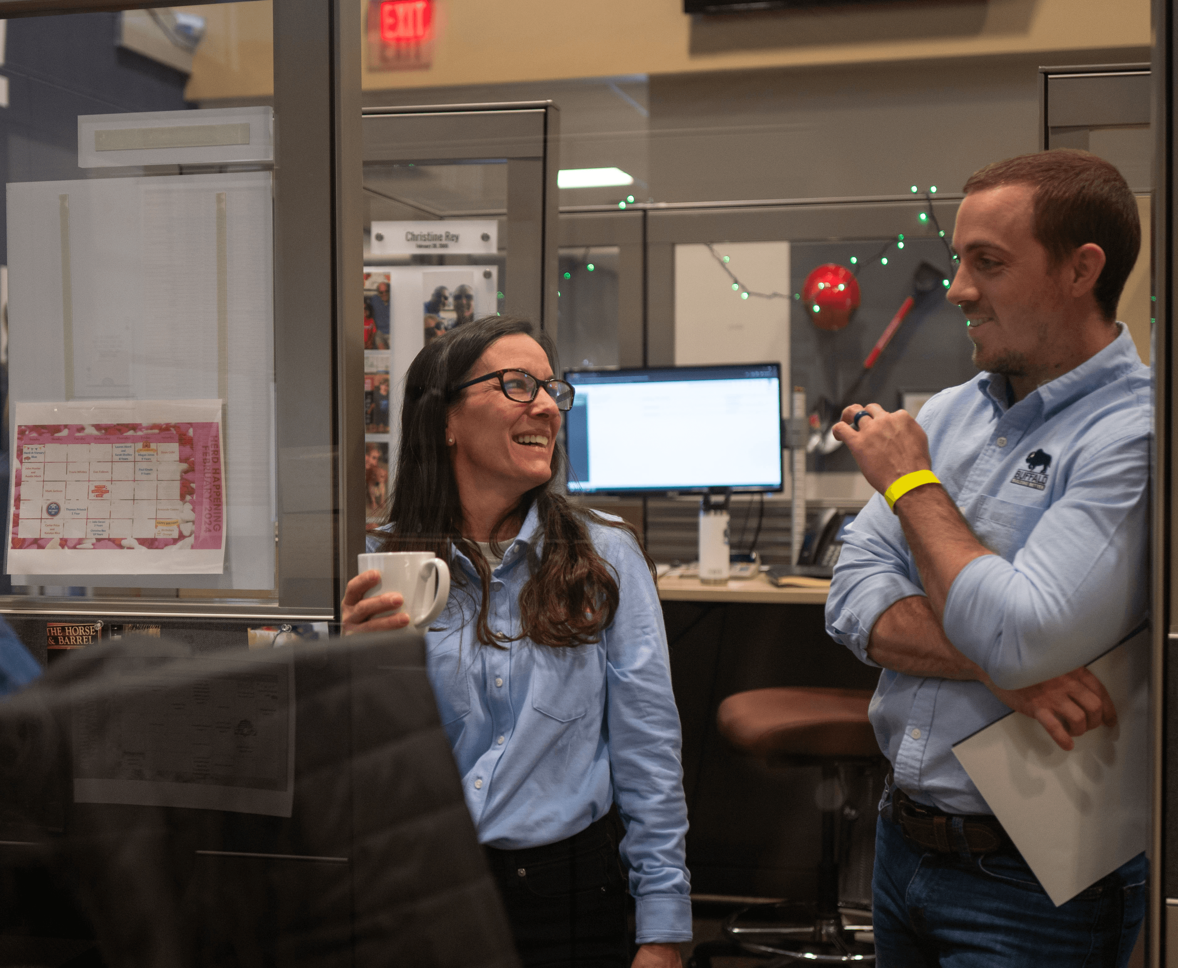 Two team members chatting in the office